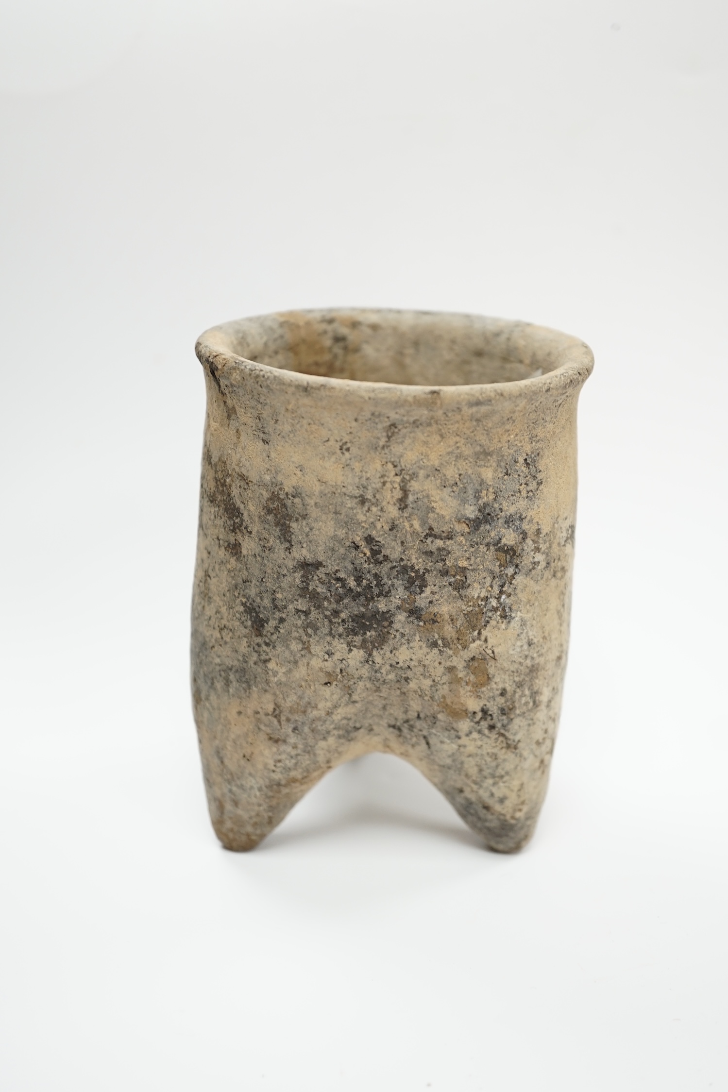 A Chinese neolithic pottery tripod vessel, 11.5cm tall